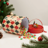 Christmas Cylinder Gift Box with candies spilled out and pine decor